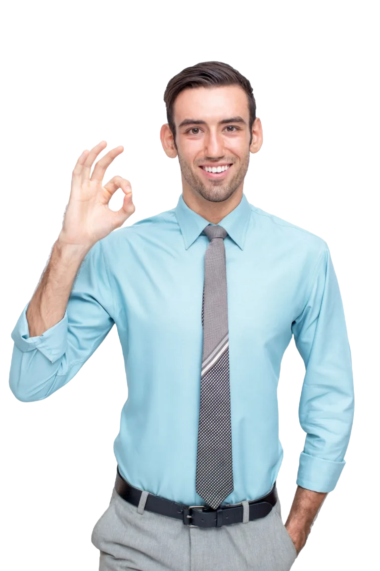 Home Smiling man wearing glasses giving a thumbs-up gesture in a striped shirt.
